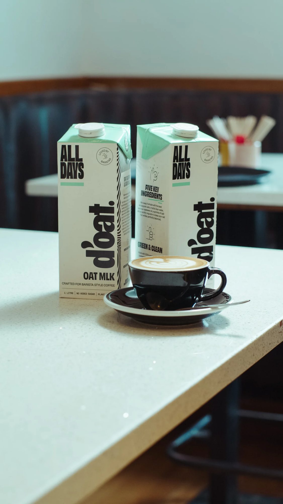 ALLDAYS cartons in a café